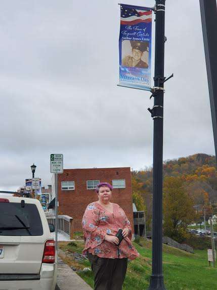 Chrissie Anderson Peters with Grandfather's banner